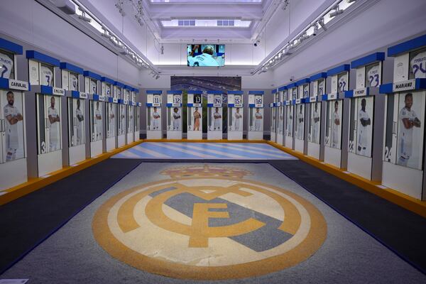 The Real Madrid first-team changing room lockers from Santiago Bernabeu Stadium are displayed at Sotheby's auction rooms in London, Wednesday, Nov. 20, 2024. The sale features 24 individual lockers previously used by footballers including Cristiano Ronaldo, David Beckham and Zinedine Zidane. (AP Photo/Kin Cheung)