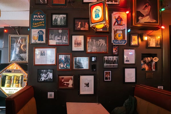 Photos and other memorabilia of former President Jimmy Carter adore the walls of the Pinkie Masters bar in Savannah, GA on December 23, 2024. (Justin Taylor/The Atlanta Journal Constitution)