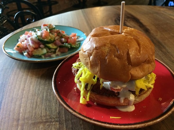 The falafel burger and a small Mediterranean salad at Rozina Bakehouse & Coffee in downtown Atlanta. CONTRIBUTED BY WENDELL BROCK