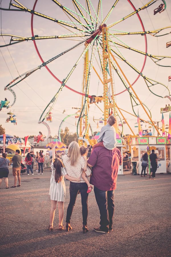 A family looks in awe at the rides at the Cumming County Fair & Festival. 
(Courtesy of the Cumming County Fair & Festival.)