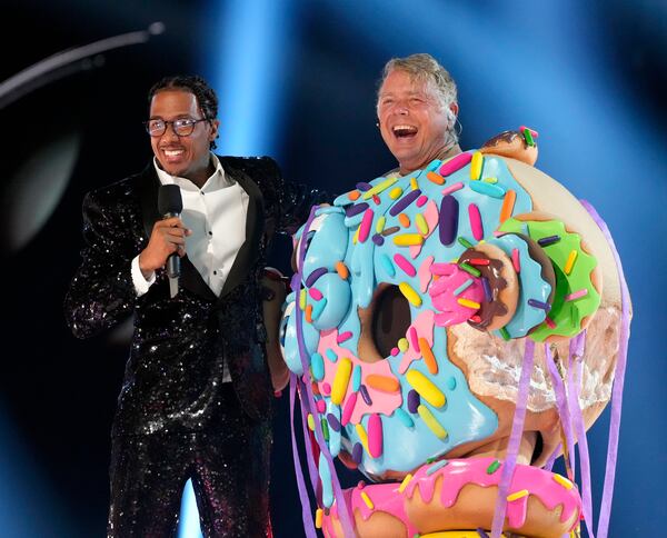 THE MASKED SINGER: L-R: Nick Cannon and  John Schneider in the two-hour season finale episode of THE MASKED SINGER airing Wednesday, Dec. 20 (8:00-10:00 PM ET/PT ) on FOX. CR: Michael Becker / FOX. ©2023 FOX Media LLC.