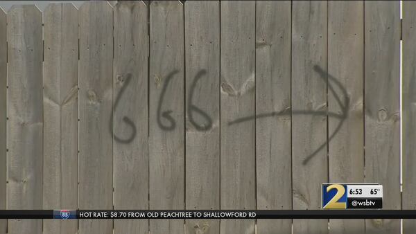 Police: Retaliation was motive for satanic symbols spray-painted in neighborhood