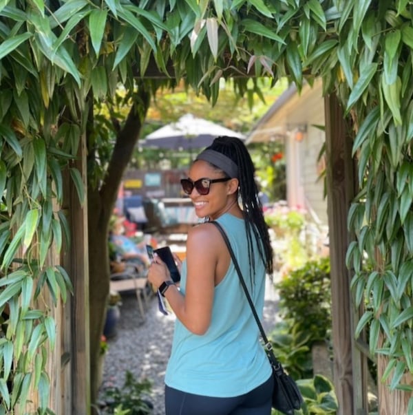 A garden tour guest gets ready to see what’s behind the doors in Midtown during the Midtown Neighbors Association's Garden Stroll. 
(Courtesy of the Midtown Garden Stroll)