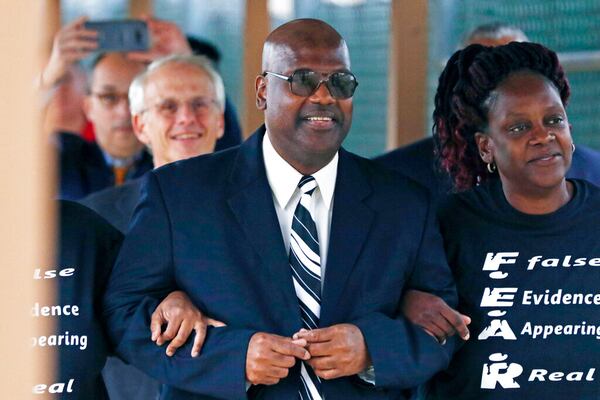 Curtis Flowers, flanked by sister Priscilla Ward, exits the Winston Choctaw Regional Correctional Facility in Louisville, Mississippi, in 2019. At the time, Flowers' murder conviction was overturned by the U.S. Supreme Court for racial bias, and he was granted bond by a circuit judge and is free, with some conditions, for the first time in 22 years. (AP Photo/Rogelio V. Solis)