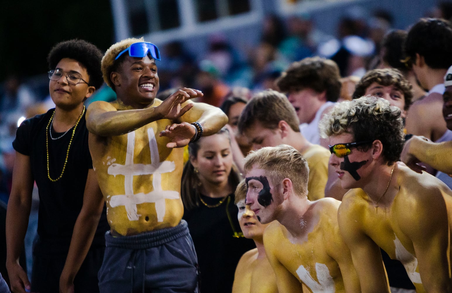 Harrison students dance and cheer during the Harrison vs. Pebblebrook high school football game on Friday, September 23, 2022, at Harrison high school in Kennesaw, Georgia. Pebblebrook defeated Harrison 31-14. CHRISTINA MATACOTTA FOR THE ATLANTA JOURNAL-CONSTITUTION.