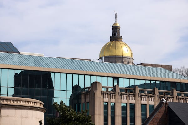 The Georgia State Capitol building is shown peaking over the Atlanta City Hall complex. Jason Getz/The Atlanta Journal-Constitution)