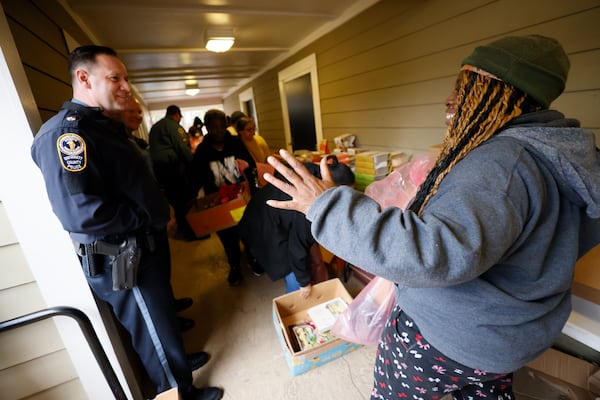 Major J.D. Griffin from the Gwinnett P.D. chats with a resident during a community outreach event at Bradford Gwinnett apartment complex on Thursday, Feb 2, 2023. Miguel Martinez / miguel.martinezjimenez@ajc.com