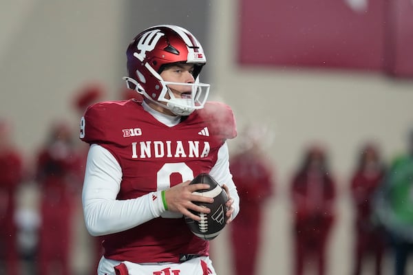 Indiana quarterback Kurtis Rourke looks to throw during the first half of an NCAA college football game against Purdue, Saturday, Nov. 30, 2024, in Bloomington, Ind. (AP Photo/Darron Cummings)