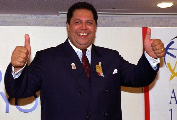 Atlanta Mayor Maynard Jackson gives thumbs-up signs during a news conference at a Tokyo hotel Tuesday, Sept. 18, 1990 after Atlanta won a bid to host the 1996 Centennial Olympic Games. 