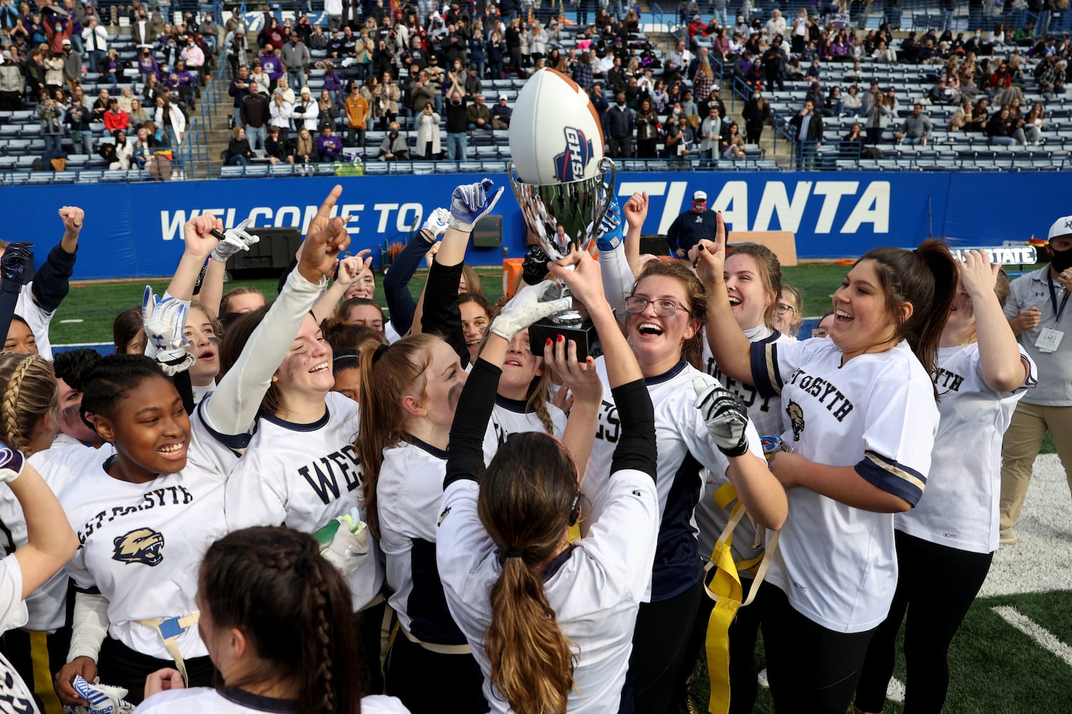 West Forsyth celebrates after their 26-25 2-OT win against Hillgrove in the Class 6A-7A Flag Football championship at Center Parc Stadium Monday, December 28, 2020 in Atlanta, Ga.. JASON GETZ FOR THE ATLANTA JOURNAL-CONSTITUTION