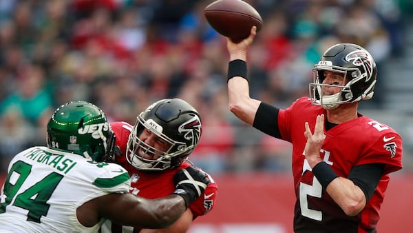 Falcons quarterback Matt Ryan (2) attempts a pass against the New York Jets Sunday, Oct. 10, 2021, at the Tottenham Hotspur stadium in London, England. (Ian Walton/AP)