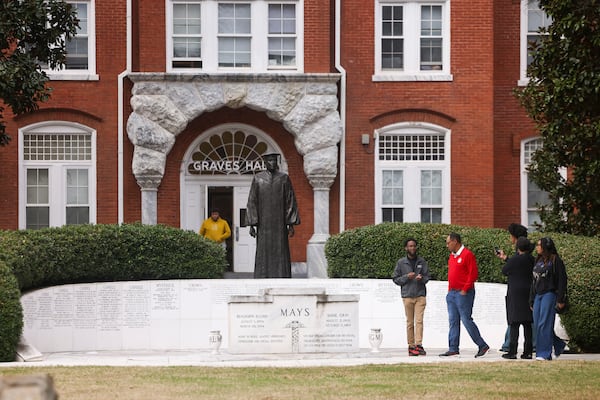 A tour guide ushers prospective students to the Benjamin E. Mays Memorial, in front of Graves Hall on the Morehouse College campus, on March 18, 2024, in Atlanta. (Jason Getz/The Atlanta Journal-Constitution/TNS)