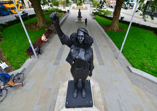 A new black resin and steel statue entitled "A Surge of Power (Jen Reid) 2020" by artist Marc Quinn stands after the statue was put up this morning on the empty plinth of the toppled statue of 17th century slave trader Edward Colston, which was pulled down during a Black Lives Matter protest in Bristol, England, Wednesday, July 15, 2020. On June 7 anti-racism demonstrators pulled the 18-foot (5.5 meter) bronze likeness of Colston down, dragged it to the nearby harbor and dumped it in the River Avon — sparking both delight and dismay in Britain and beyond. (Ben Birchall/PA via AP)