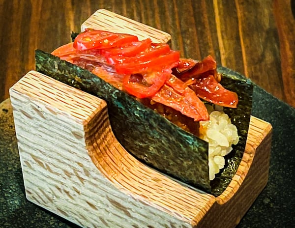 Cuddlefish's tomato temaki is the star of the hand roll selections. Henri Hollis/henri.hollis@ajc.com