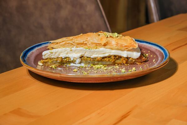 The baklava ice cream sandwich at Chelo is a pie-shaped slice of baklava filled with vanilla ice cream. Courtesy of Chelo