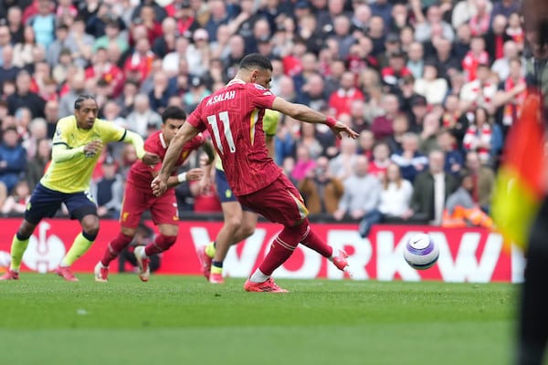 Liverpool's Mohamed Salah scores his side's second goal during the English Premier League soccer match between Liverpool and Southampton at Anfield in Liverpool, Saturday, March 8, 2025. (AP Photo/Jon Super)