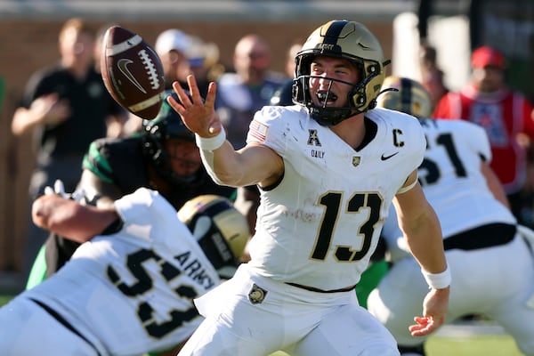 Army quarterback Bryson Daily (13) pitches the ball to a teammate on a play against North Texas in the first half of an NCAA football game Saturday, Nov. 9, 2024, in Denton, Texas. (AP Photo/Richard W. Rodriguez)