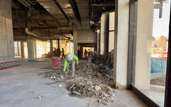 Demolition workers prepare what was once the lobby of the old Macon Hilton for implosion on New Year's Day. (Joe Kovac Jr. / AJC)