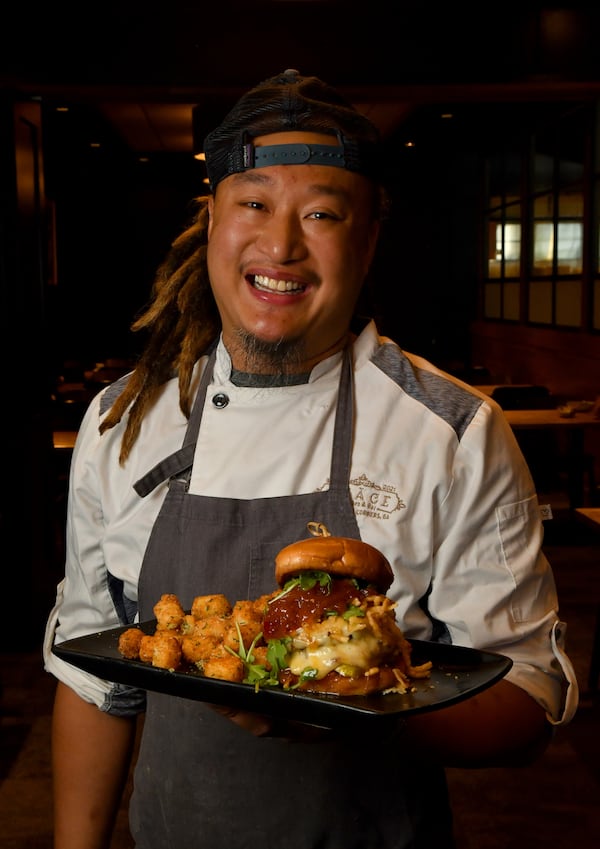 Chef Vereak Chum of Stage Kitchen & Bar in Peachtree Corners shows off the Death by Peaches Burger. (Styling by chef Vereak Chum / Chris Hunt for the AJC)