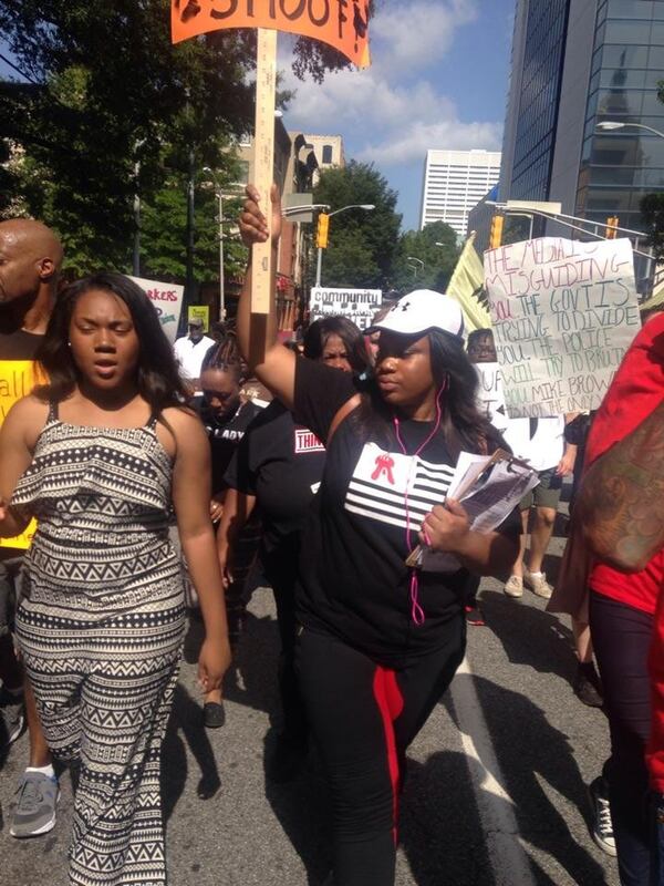 Mary-Pat Hector (right) and supporters stage a peaceful protest against gun violence in downtown Atlanta. Hector launched Think Twice, a campaign to get young people to just say no to guns. CONTRIBUTED BY THINK TWICE