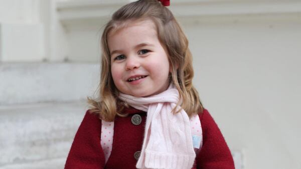 In this handout picture provided by the Duke and Duchess of Cambridge, Britain's Princess Charlotte smiles as she prepares for her first day of nursery at the Willcocks Nursery School, in London, Monday, Jan. 8, 2018. (Duchess of Cambridge via AP)