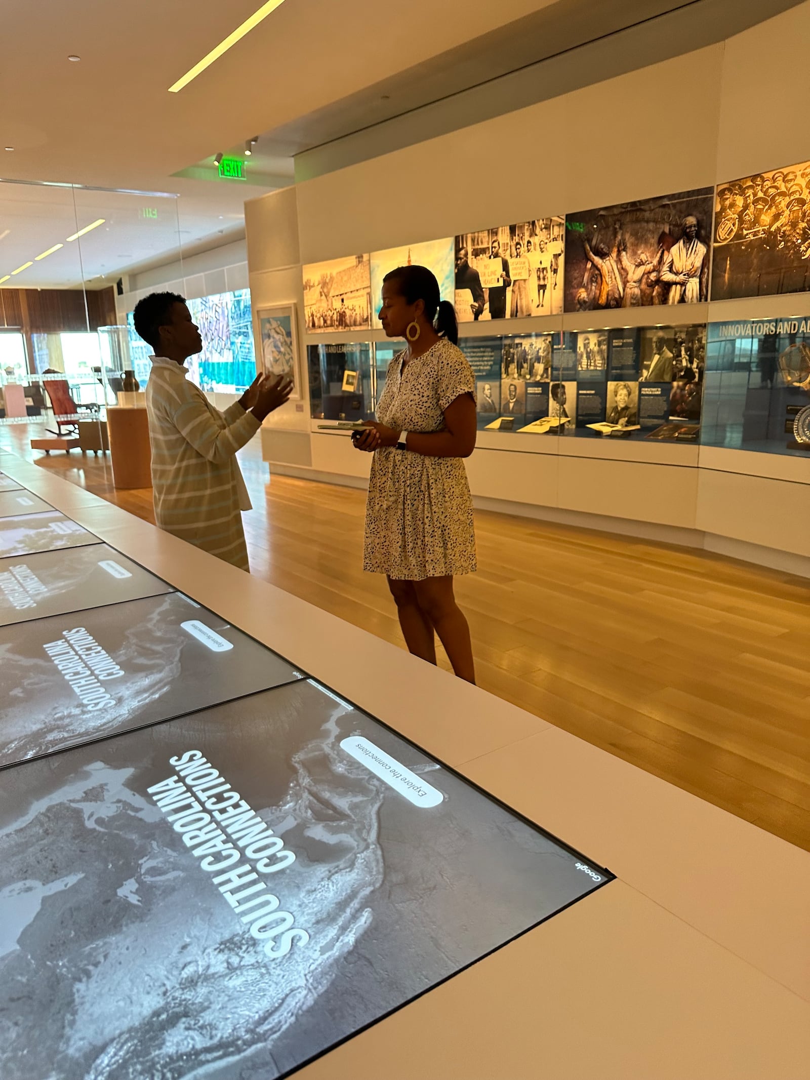 Malika Pryor, chief learning and engagement officer for the IAAM, explains how the gallery "South Carolina Connections" provides insight into lesser known people and places relevant to South Carolina's African diasporic and African American history. Courtesy of Nedra Rhone