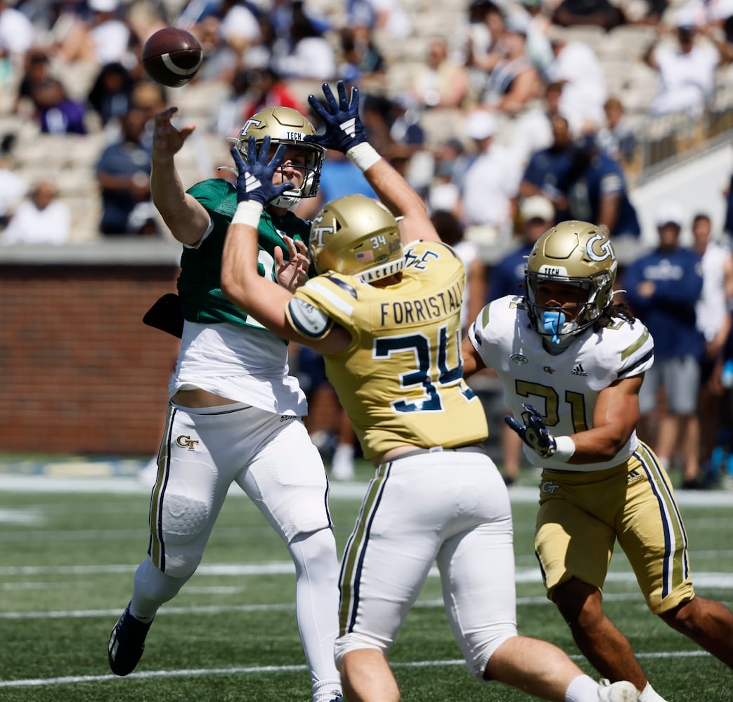 Georgia Tech quarterback Graham Knowles (14) has a pass tipped by Georgia Tech linebacker Myles Forristall (34) during the Spring White and Gold game at Bobby Dodd Stadium at Hyundai Field In Atlanta on Saturday, April 13, 2024.   (Bob Andres for the Atlanta Journal Constitution)