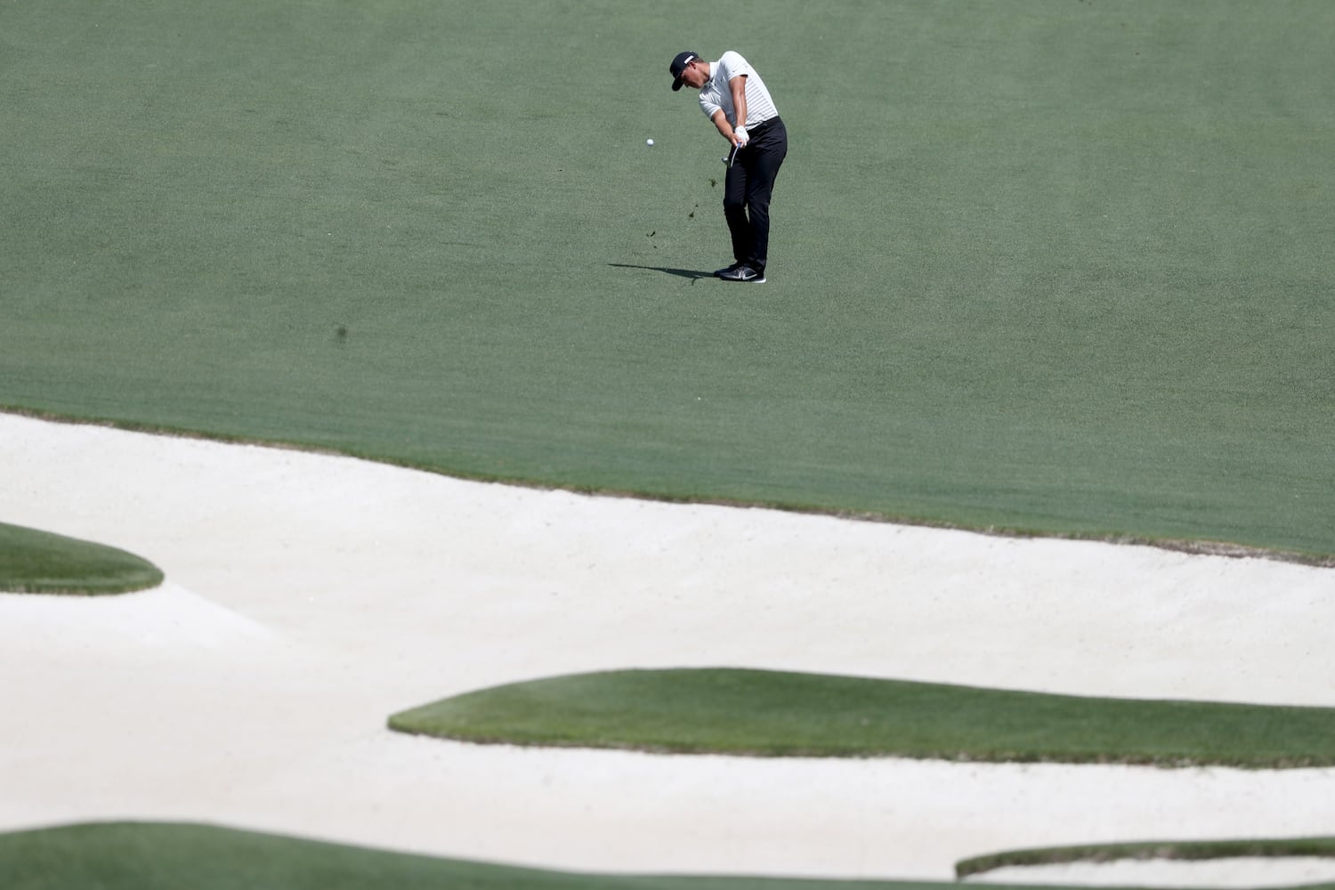 April 8, 2021, Augusta: Cameron Champ hits on the tenth fairway during the first round of the Masters at Augusta National Golf Club on Thursday, April 8, 2021, in Augusta. Curtis Compton/ccompton@ajc.com