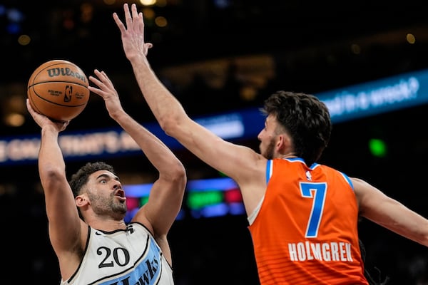 Atlanta Hawks forward Georges Niang (20) shoots against Oklahoma City Thunder forward Chet Holmgren (7) during the first half of an NBA basketball game, Friday, Feb. 28, 2025, in Atlanta. (AP Photo/Mike Stewart)