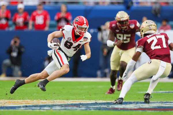 Georgia wide receiver Ladd McConkey (84) makes a move after a reception during the first half against Florida State in the Orange Bowl at Hard Rock Stadium, Saturday, Dec. 30, 2023, in Miami Gardens, Florida. Georgia won 63-3 against Florida State. (Jason Getz / Jason.Getz@ajc.com)