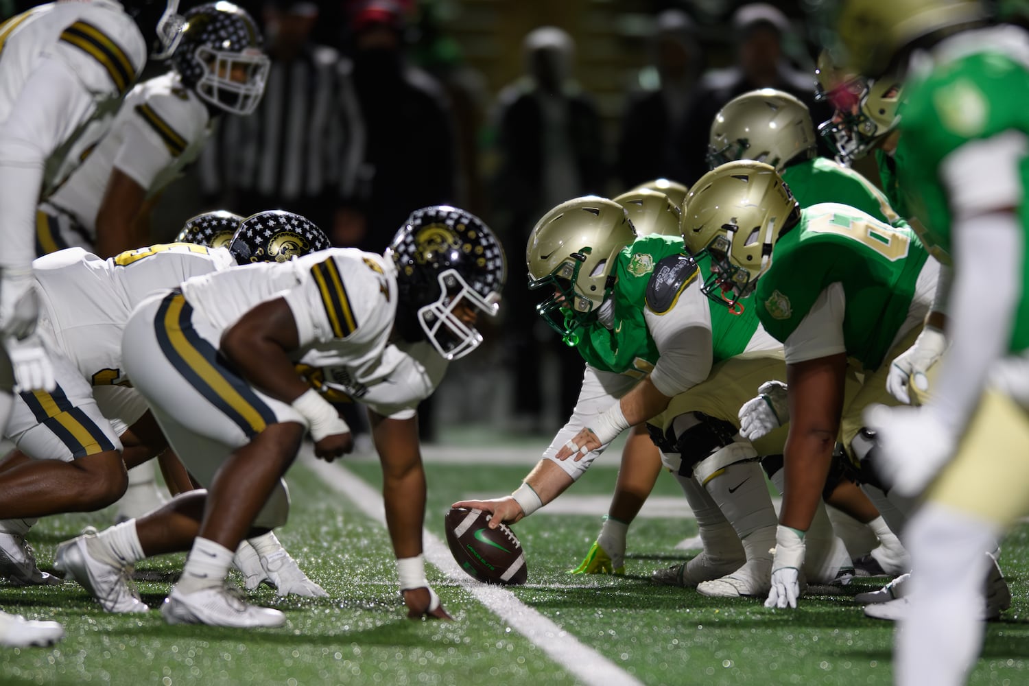 The teams line up during the Buford vs. Carrollton semifinal. (Jamie Spaar for the Atlanta Journal Constitution)