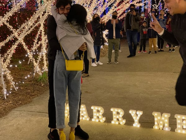 Talk about a Tunnel of Joy -- this young couple got engaged there. Richard Taylor is aware of at least three couples who have said "yes" at Lights of Joy. Courtesy of Richard Taylor