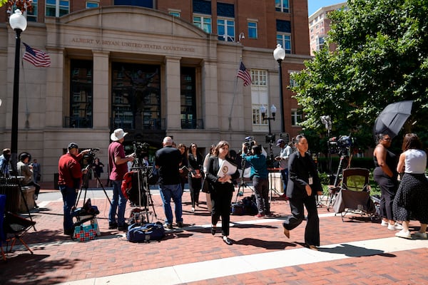 FILE - Lawyers and legal assistants leave the U.S. District Court for the Eastern District of Virginia for a lunch break in the Department of Justice's antitrust trial against tech giant Google, Sept. 9, 2024, in Alexandria, Va. (AP Photo/Stephanie Scarbrough, File)