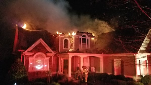 Heavy flames damaged the attic of a home in Hall County Friday. (Credit: Hall County Fire Services)