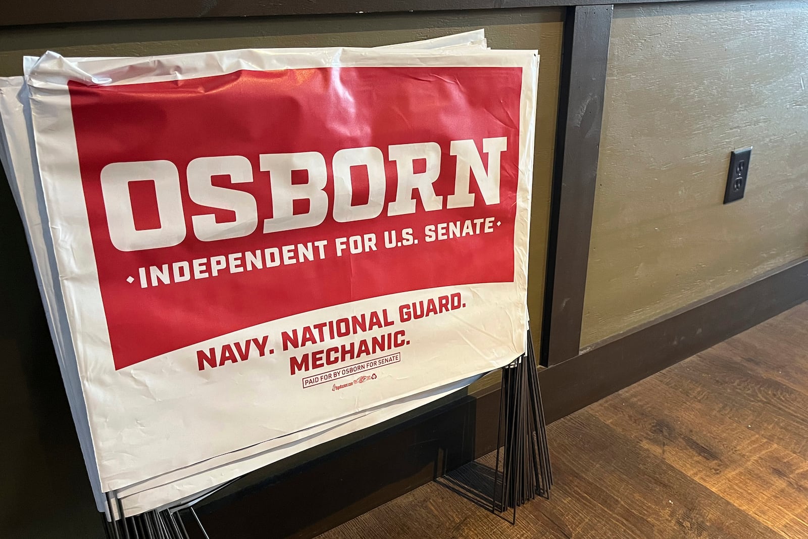 Political yard signs for Dan Osborn, an independent candidate for the U.S. Senate, sit outside a campaign event he held in Beatrice, Neb., July 30, 2024. (AP Photo/Margery Beck)