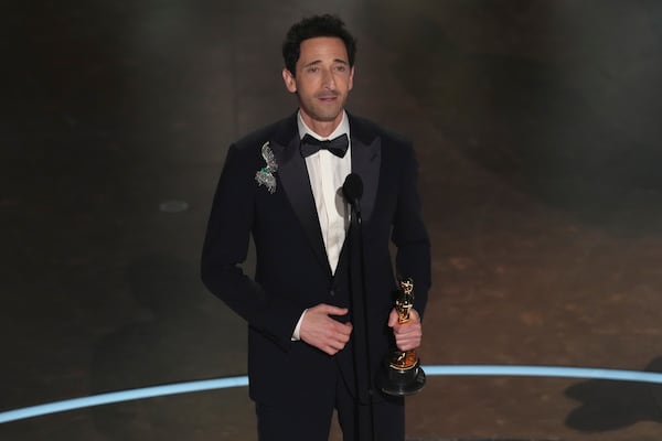 Adrien Brody accepts the award for best performance by an actor in a leading role for "The Brutalist" during the Oscars on Sunday, March 2, 2025, at the Dolby Theatre in Los Angeles. (AP Photo/Chris Pizzello)