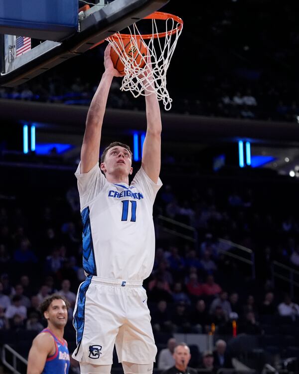 Creighton's Ryan Kalkbrenner (11) dunks the ball in front of DePaul's Troy D'Amico during the first half of an NCAA college basketball game at the Big East basketball tournament Thursday, March 13, 2025, in New York. (AP Photo/Frank Franklin II)