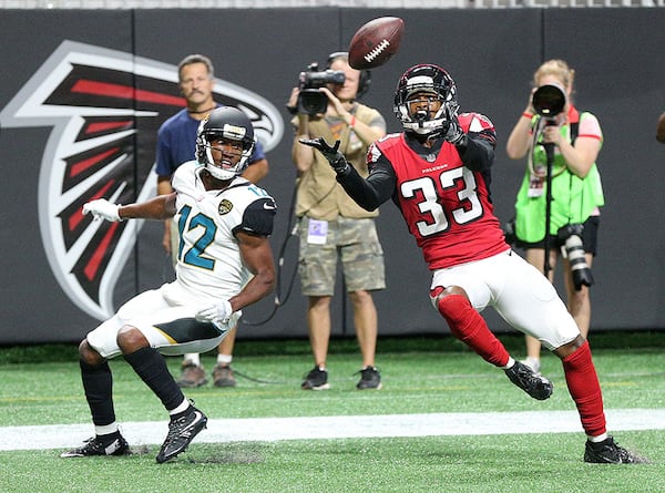 Falcons cornerback Blidi Wreh-Wilson intercepts the ball in front of Jaguars wide receiver Dede Westbrook in the endzone during the first quarter in a NFL preseason football game on Thursday, Aug. 31, 2017, in Atlanta.