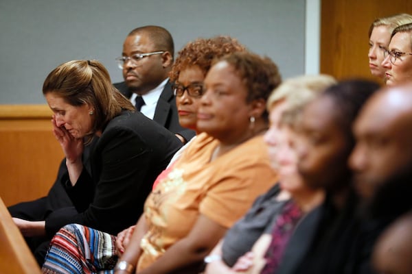 April 30, 2019 - Lawrenceville - Emily Gilbert (left) and Brad Gardner, state capital public defenders and standby council for Tiffany Moss, react to the verdict. The jury in the Tiffany Moss murder trial today sentenced her to death after they found Moss, who is representing herself, guilty of intentionally starving her 10-year-old stepdaughter Emani to death in the fall of 2013, in addition to other charges. The prosecution is asking for the death penalty.   Bob Andres / bandres@ajc.com