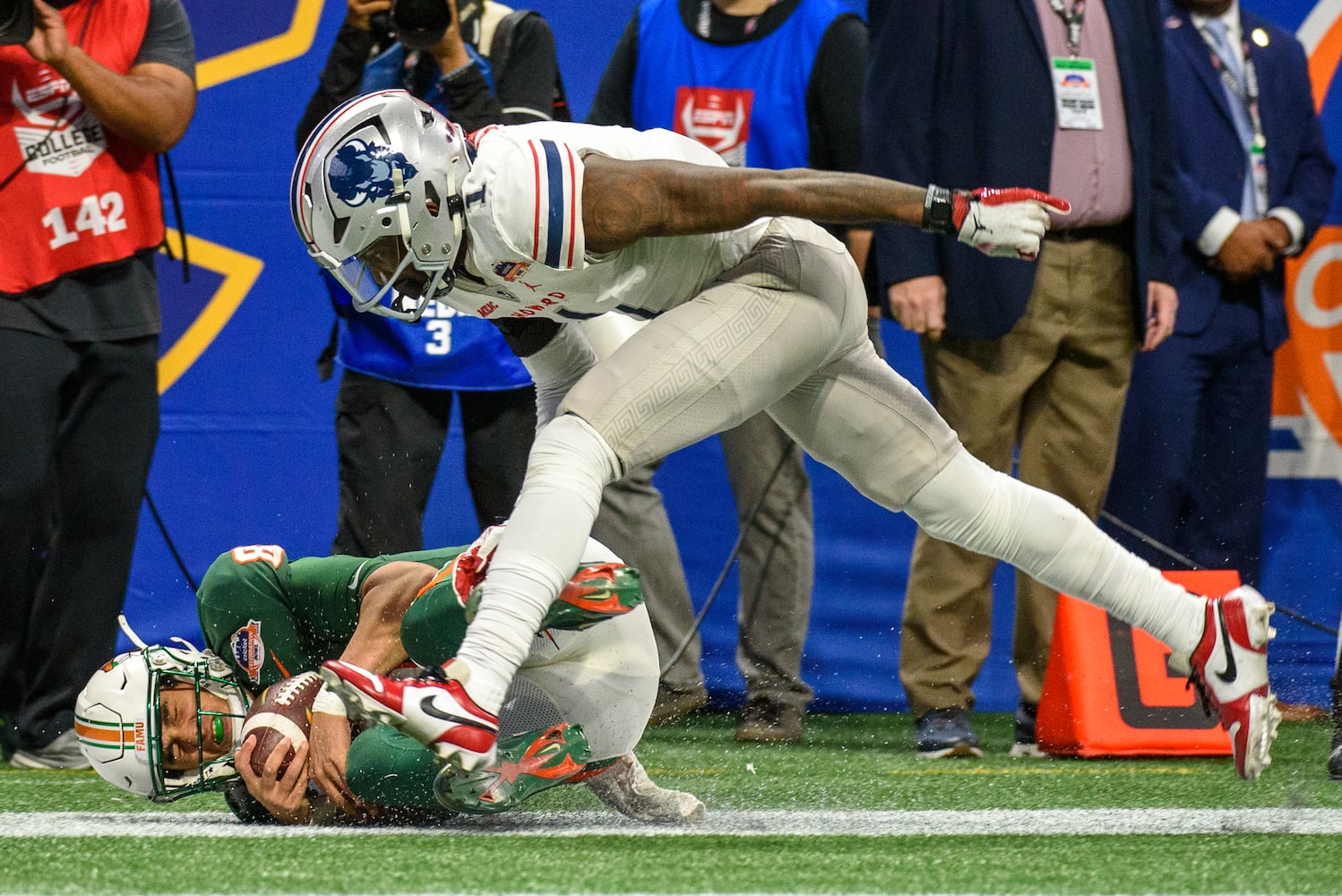 Florida A&M quarterback Jeremy Moussa catches a pass and scores a touchdown against Howard in the Celebration Bowl at Mercedes Benz Stadium in Atlanta, Georgia on Dec. 16, 2023. (Jamie Spaar for the Atlanta Journal Constitution)