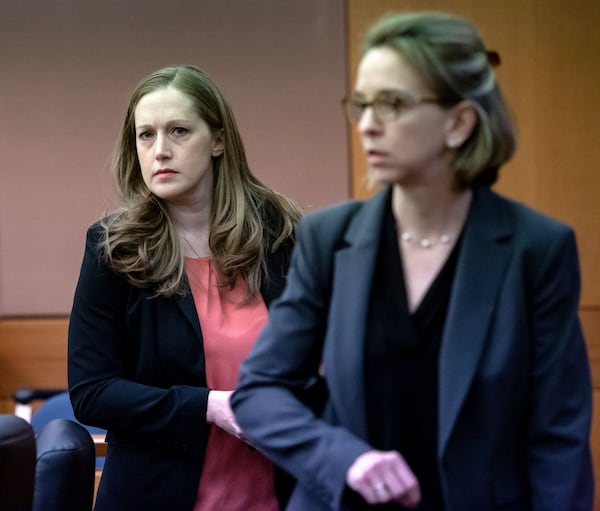 Senior Assistant Attorney General Blair McGowan, left, and her colleague, Laura Pfister, walk through the courtroom before a pre-trial hearing Monday in the case of Jenna Garland, a former press secretary to former Atlanta Mayor Kasim Reed. Garland has been charged with two misdemeanor counts of violating the Georgia Open Records Act. STEVE SCHAEFER / SPECIAL TO THE AJC