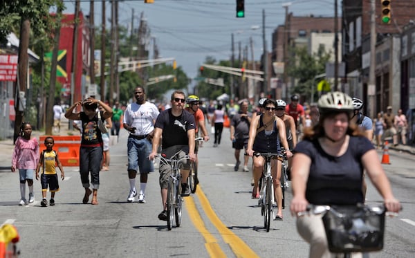 100523 - Atlanta - Edgewood Ave. is filled with pedestrians and bike riders as the street was closed for Atlanta Streets Alive. Modeled after similar events from around the world, including Colombia, San Francisco, Cleveland, and Paris, the first-ever Atlanta Streets Alive took place on Edgewood Ave. from Woodruff Park to Randolph St. Sunday. Atlanta Streets Alive was a ciclovia where the organizers closed streets to cars and opened them to all kinds of organized activities -- including belly dancing, street performing, fitness, hula hoops, tai chi, and dancing, all for free. Hundred of participants rode their bikes or walked the streets and took part in activities. Sun, May 23, 2010 Bob Andres, bandres@ajc.com