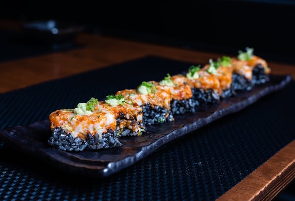 The Roku roll at District M is made with squid ink rice, lobster salad and wasabi creme fraiche. CONTRIBUTED BY HENRI HOLLIS