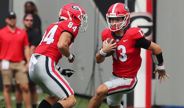 Georgia QB Stetson Bennett scrambles for yardage in the first half of Saturday's game against Arkansas. (Curtis Compton/ccompton@ajc.com)