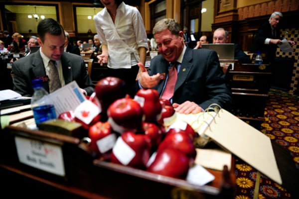 Wednesday was also a good day for snacks. Rep. Bob Smith (R-Watkinsville), vice chairman of the appropriations committee for higher education, arrives to a desk full of apples as a joke from other representatives at the Capitol. The apples were placed on desks by the Georgia PTA, encouraging a vote for HB 901.