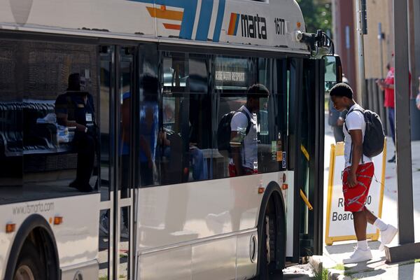 Passengers get on a MARTA bus at the H.E. Holmes MARTA Station, Tuesday, May 31, 2022, in Atlanta. (Jason Getz / Jason.Getz@ajc.com)