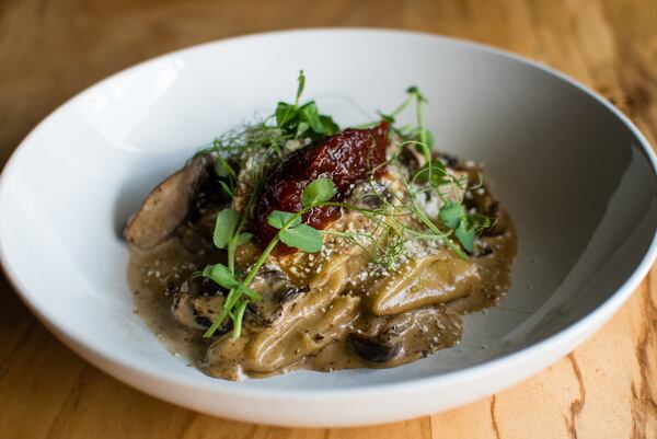 Silk handkerchief pasta with roasted wild mushrooms, porcini cream, tomato marmalade and cotija cheese at Better Half. / CONTRIBUTED BY HENRI HOLLIS