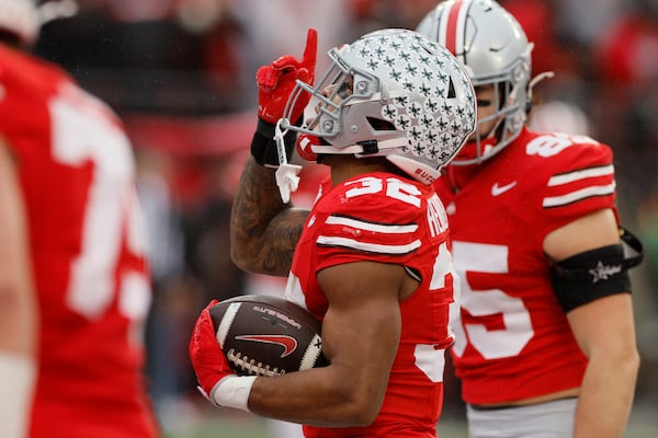 Ohio State running back TreVeyon Henderson celebrates his touchdown against Indiana during the first half of an NCAA college football game Saturday, Nov. 23, 2024, in Columbus, Ohio. (AP Photo/Jay LaPrete)