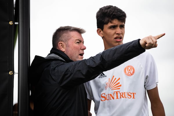 Atlanta United Academy Director Tony Annan gives instructions to Atlanta United academy player Efrain Morales, a native of Suwanee. (Atlanta United)