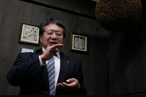 Hitoshi Utsunomiya, director of the Japan Sake and Shochu Makers Association, speaks during a media tour at Ozawa Sake Brewery in Ome, on the western outskirts of Tokyo, Japan, Wednesday, Nov. 13, 2024. (AP Photo/Hiro Komae)